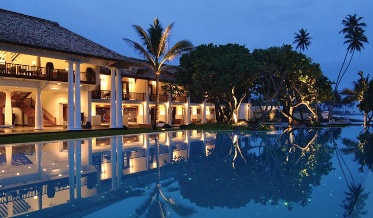 The Fortress Sri Lanka outdoor pool at night trees hotel exterior