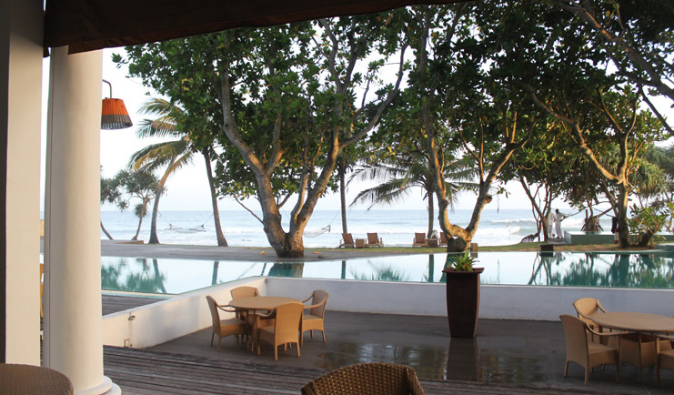 The Fortress Sri Lanka pool deck terrace area beach view hammock trees