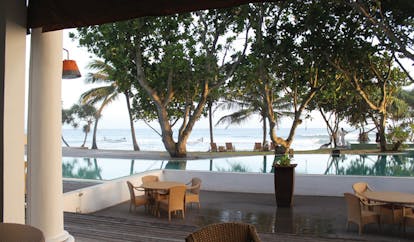 The Fortress Sri Lanka pool deck terrace area beach view hammock trees