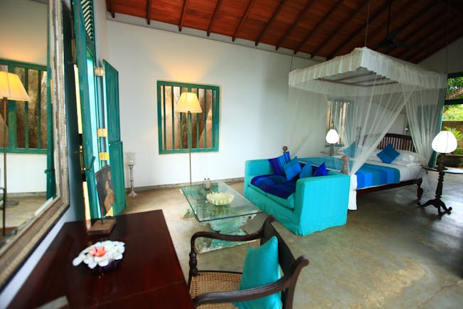 The Last House Sri Lanka moonamal room canopied bed sofa colourful rustic décor