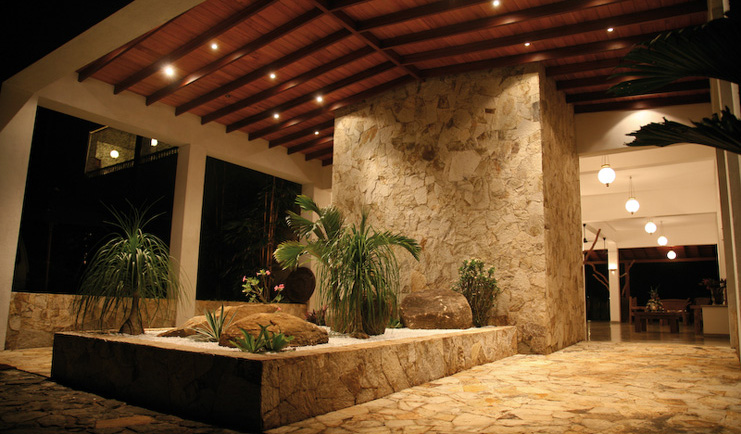 Weligama Bay Resort Sri Lanka entrance stone covered building with palms 