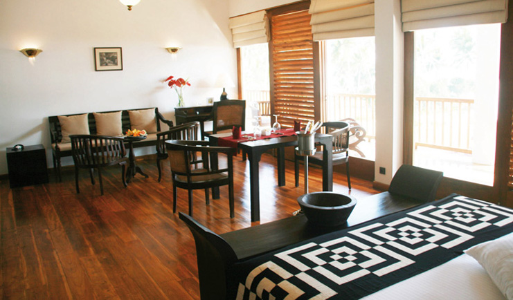 Weligama Bay Resort Sri Lanka junior suite bedroom with seating area and balcony