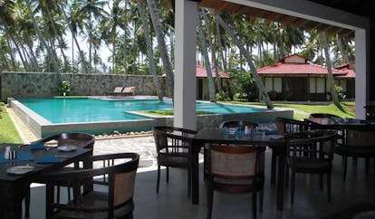 Weligama Bay Resort Sri Lanka pool bar outdoor dining area with pool view