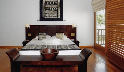 Weligama Bay Resort Sri Lanka royal suite bedroom with black and white decor and large windows