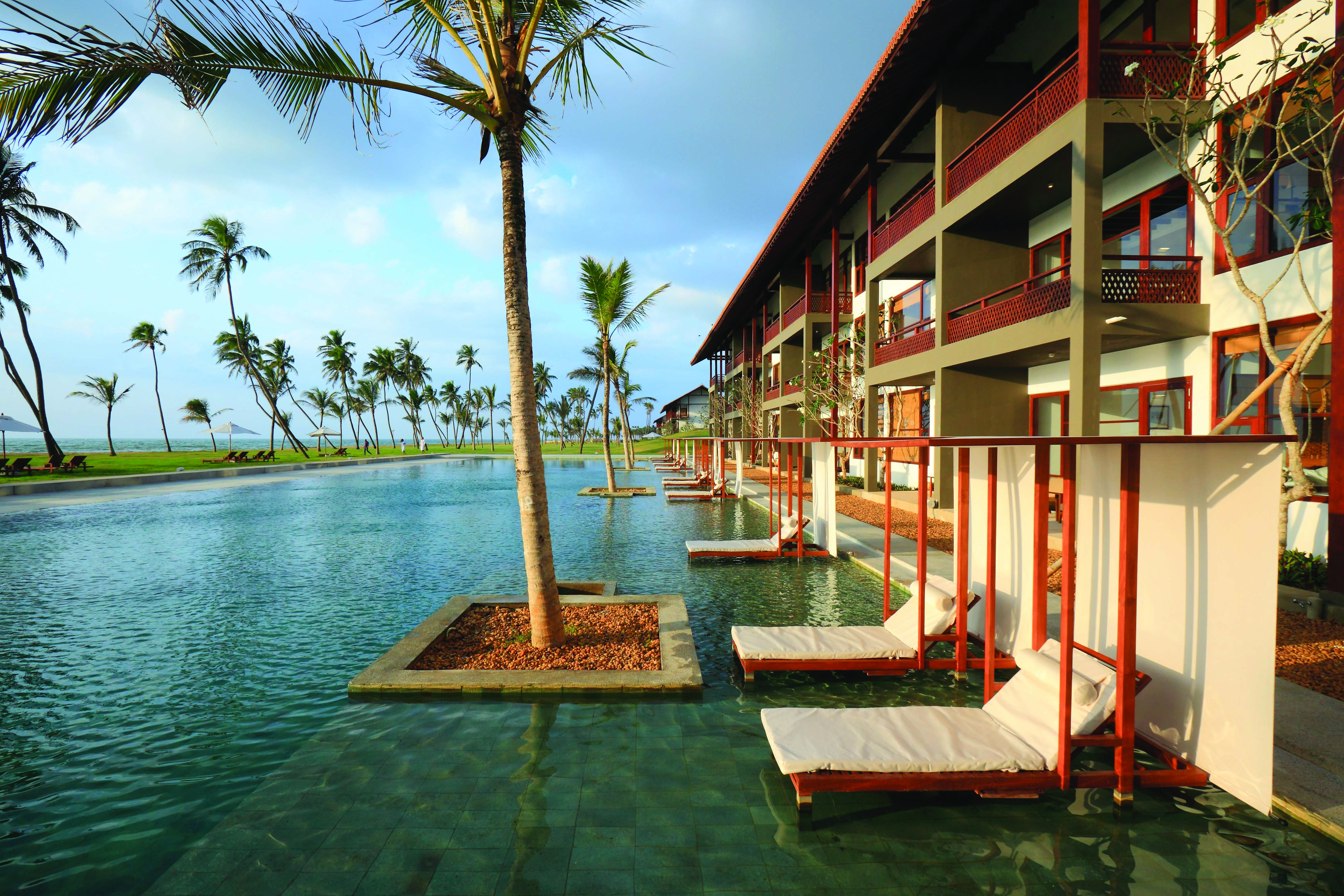 Anantaya Chilaw Resort Sri Lanka pool sun loungers palm trees ocean views
