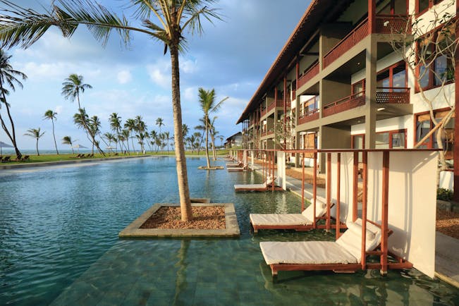 Anantaya Chilaw Resort Sri Lanka pool sun loungers palm trees ocean views