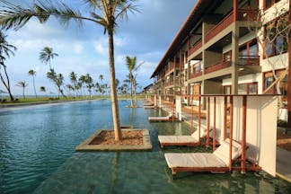 Anantaya Chilaw Resort Sri Lanka pool sun loungers palm trees ocean views