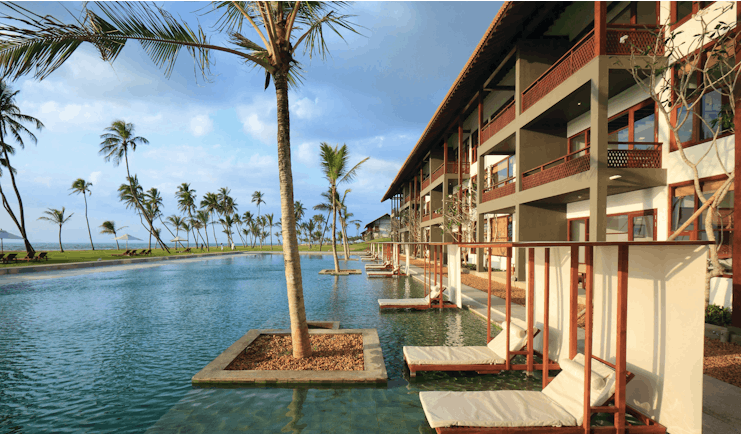 Anantaya Chilaw Resort Sri Lanka pool sun loungers palm trees ocean views