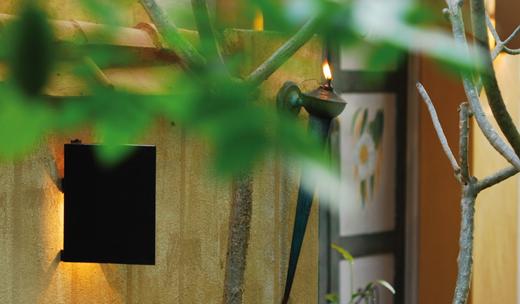Ayurveda Pavilions Sri Lanka building yellow walls painted doors wall torch
