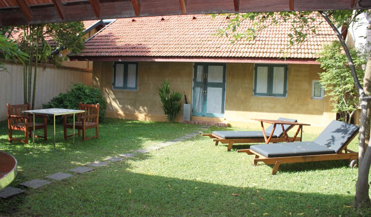 Ayurveda Pavilions Sri Lanka king villa exterior bungalow table sun loungers
