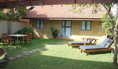 Ayurveda Pavilions Sri Lanka king villa exterior bungalow table sun loungers