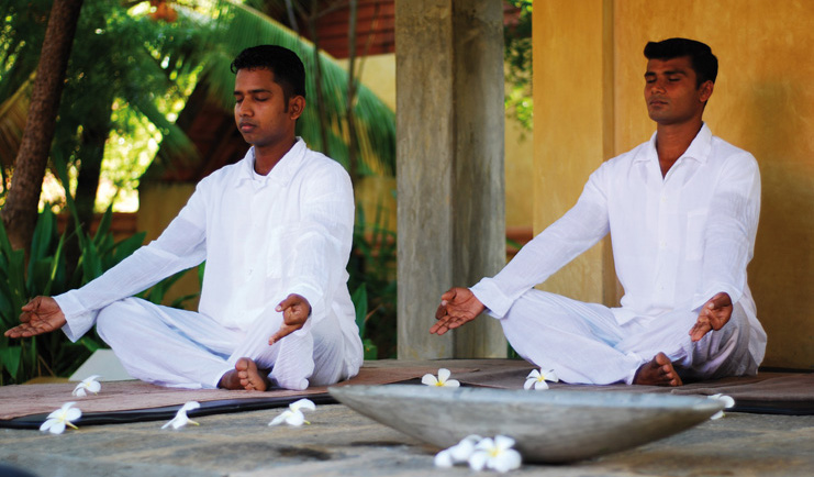 Ayurveda Pavilions Sri Lanka yoga two men in white practicing yoga