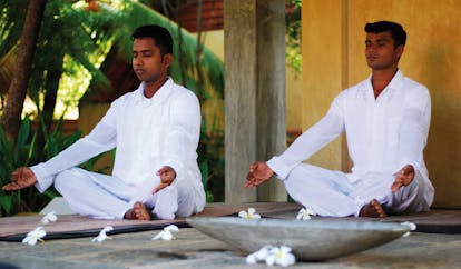 Ayurveda Pavilions Sri Lanka yoga two men in white practicing yoga