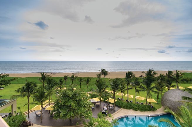 Heritance Negombo Sri Lanka beach view pool trees lawn sand sea