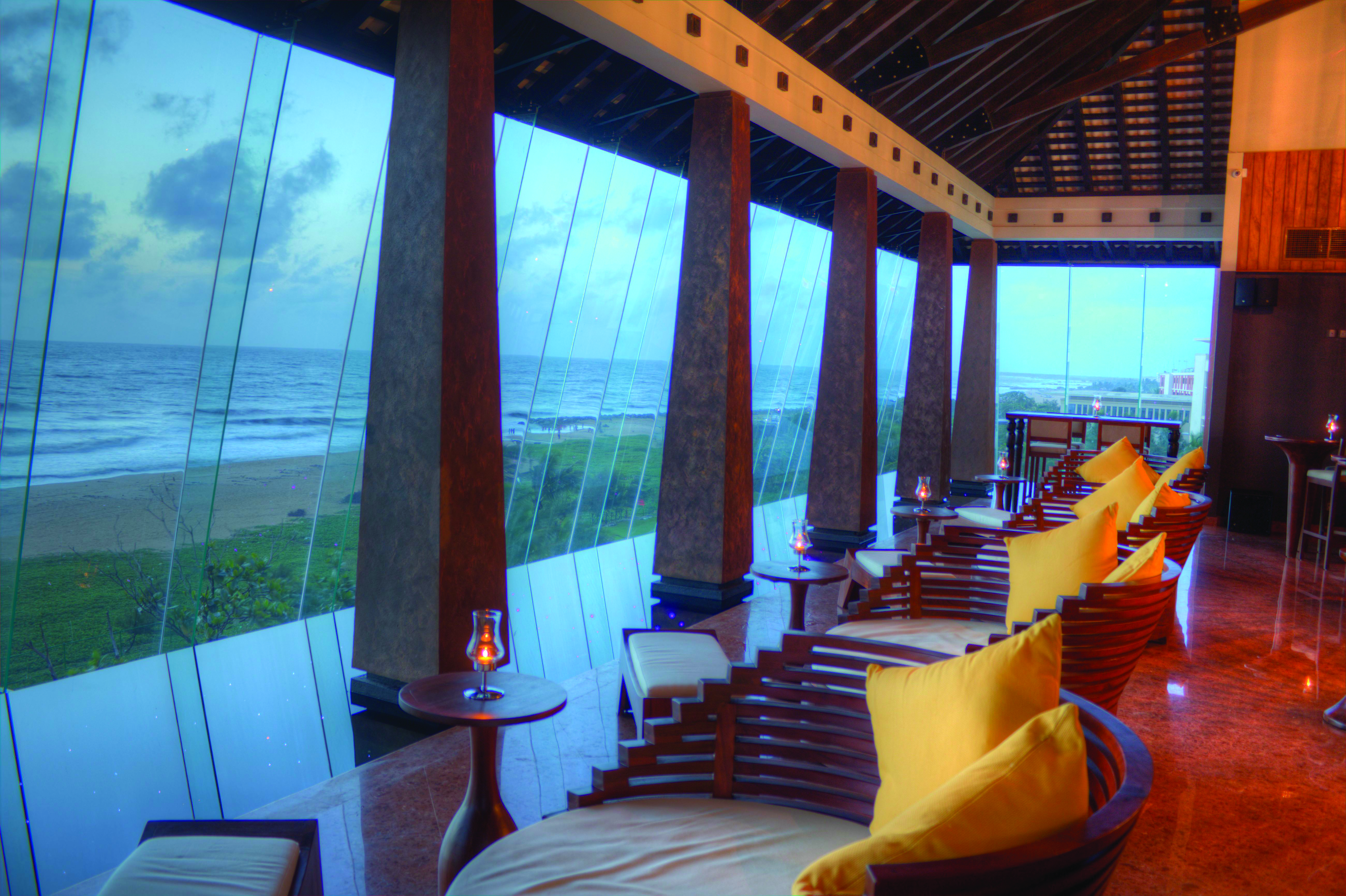Heritance Negombo Sri Lanka lounge indoor communal seating area large glass windows sea views