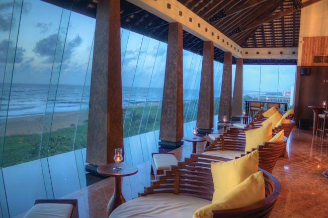 Heritance Negombo Sri Lanka lounge indoor communal seating area large glass windows sea views