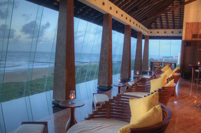 Heritance Negombo Sri Lanka lounge indoor communal seating area large glass windows sea views
