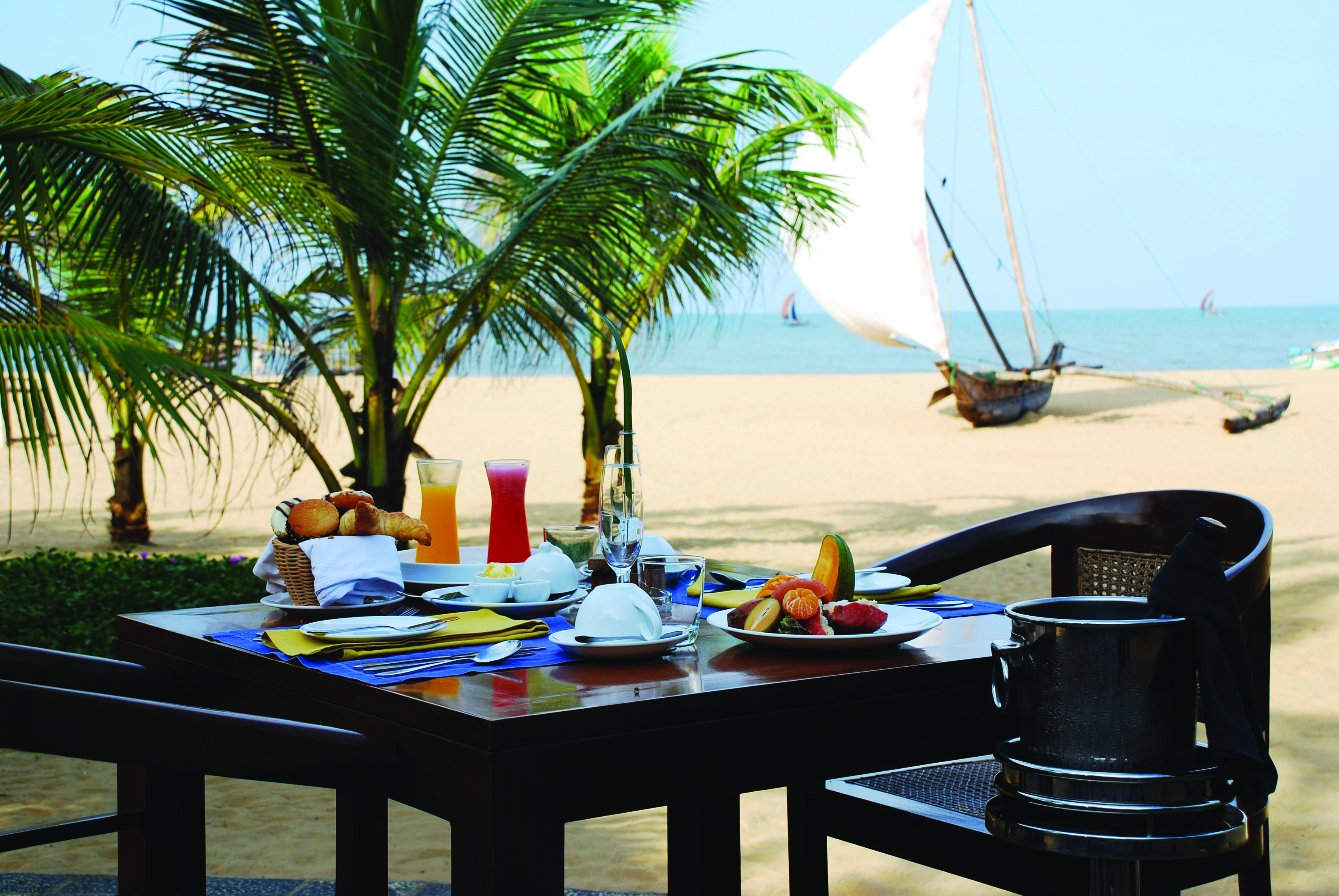 Jetwing Beach Sri Lanka beach breakfast greenery boat on the beach