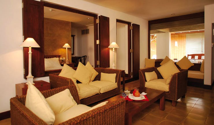 Jetwing Beach Sri Lanka luxury suite lounge area sofas table view of bed