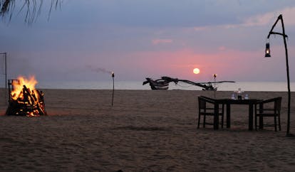 Jewting Beach Sri Lanka sunset dining on the beach table set for two bonfire