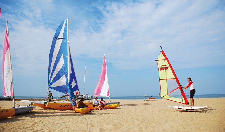 Jetwing Beach Sri Lanka windsurfing man demonstrating windsurfing technique on the beach