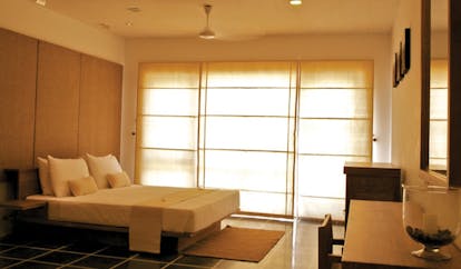 Jetwing Blue Sri Lanka bedroom with large windows minimalist decor