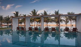 Jetwing Blue Sri Lanka pool sun loungers umbrellas palm trees