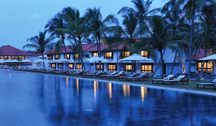 Jetwing Lagoon Sri Lanka pool palm trees sun loungers umbrellas