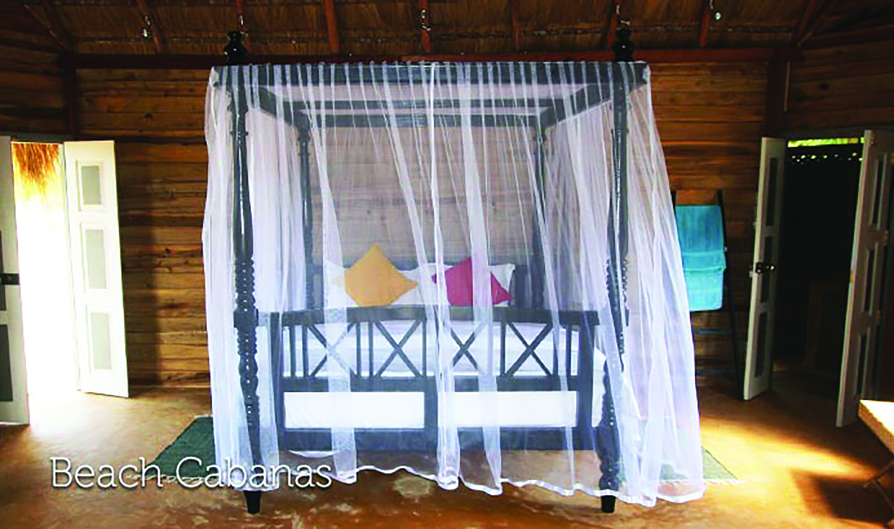 Palagama Beach beach cabana bedroom, canopied double bed, wooden walls, traditional decor