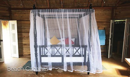 Palagama Beach beach cabana bedroom, canopied double bed, wooden walls, traditional decor