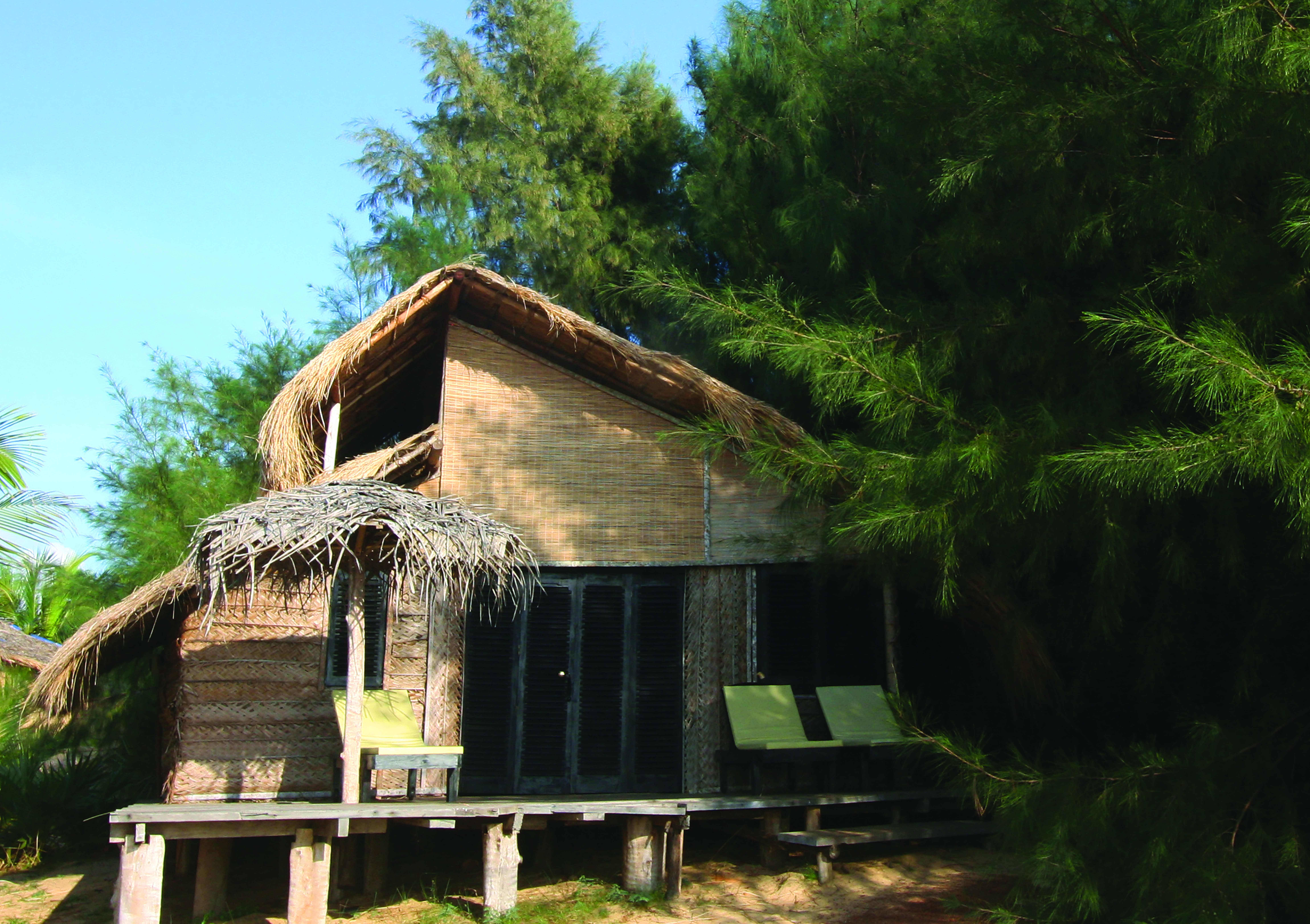 Palagama Beach garden cabana exterior, private terrace with bench, surrounded by trees