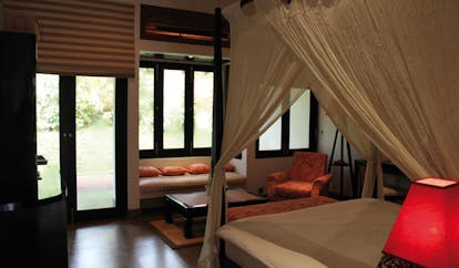 The Wallawwa Sri Lanka garden suite bedroom four poster bed seating area