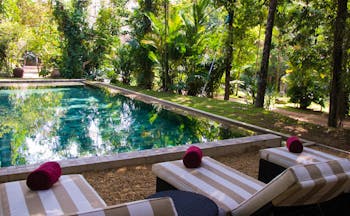 The Wallawwa Sri Lanka outdoor pool sun loungers palm trees