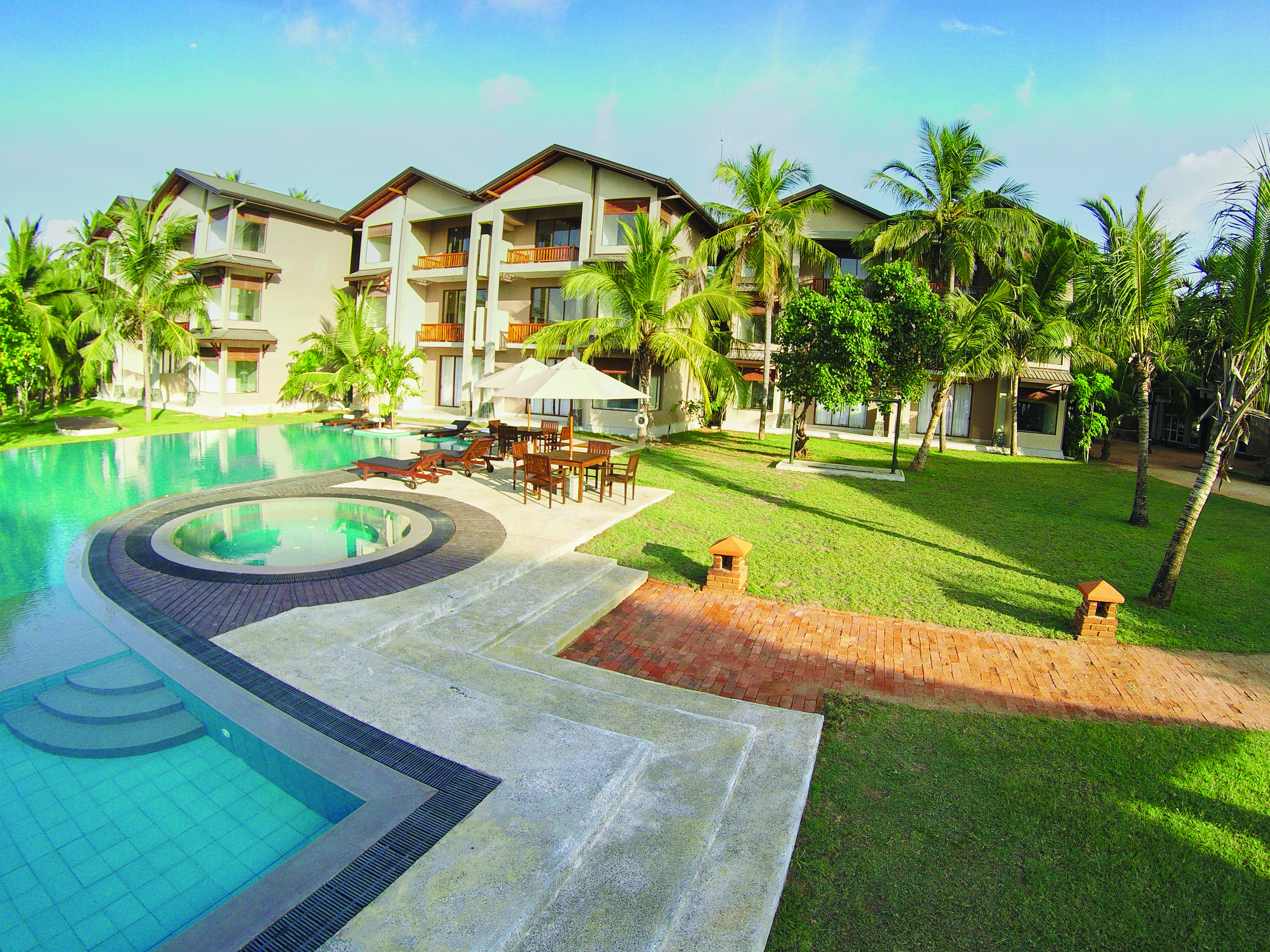 Aramanthe Bay Sri Lanka exterior hotel buildings palm trees lawns pool
