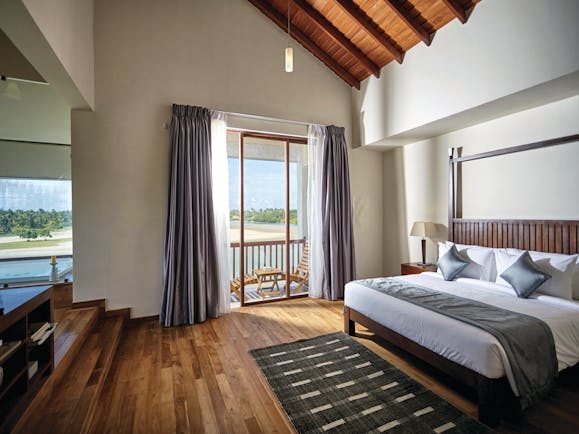 Aramanthe Bay Sri Lanka junior guest suite bed wooden floors modern décor