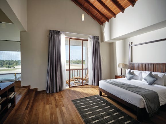 Aramanthe Bay Sri Lanka junior guest suite bed wooden floors modern décor