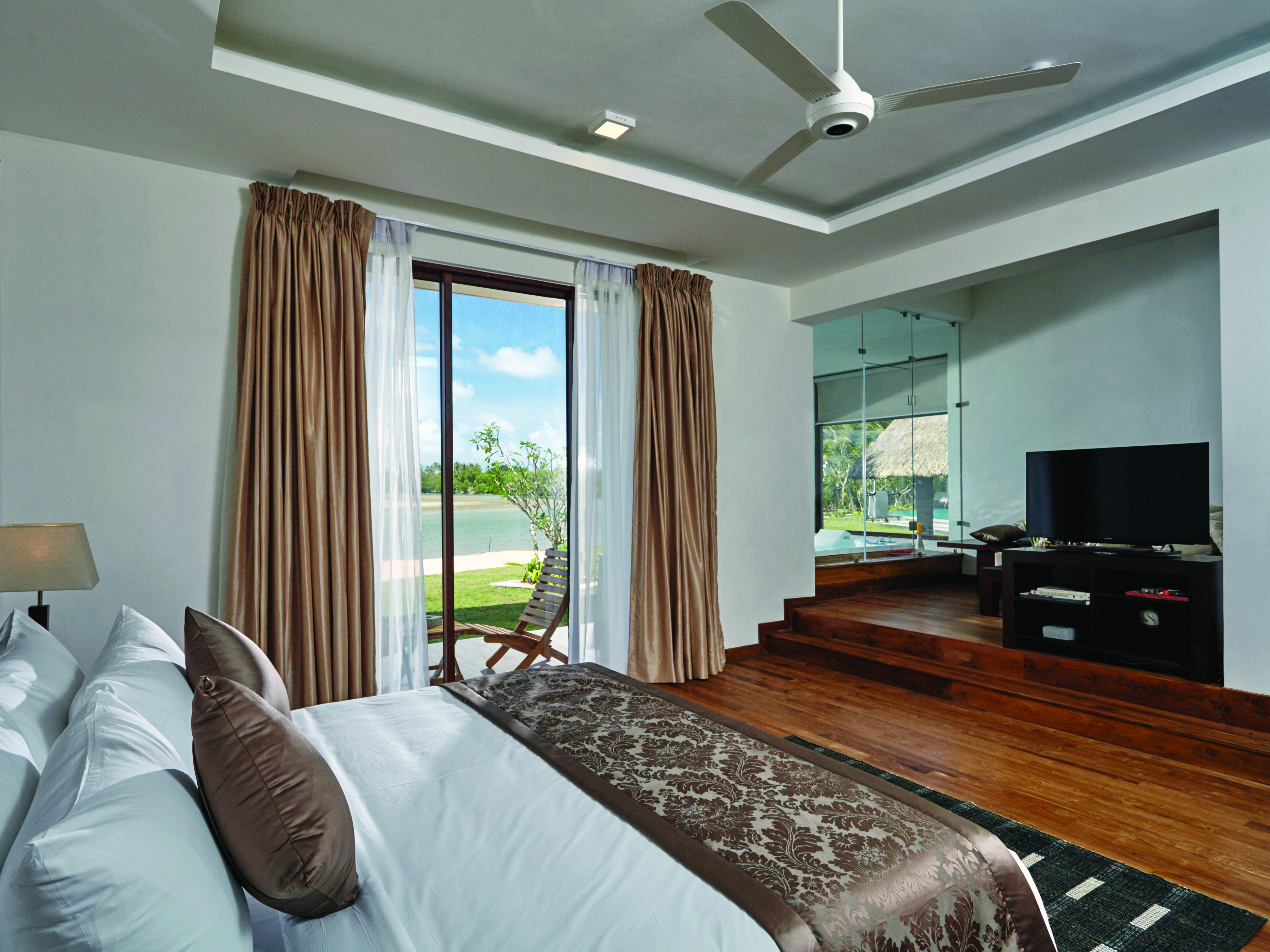 Aramanthe Bay Sri Lanka junior suite bed wooden floors private terrace