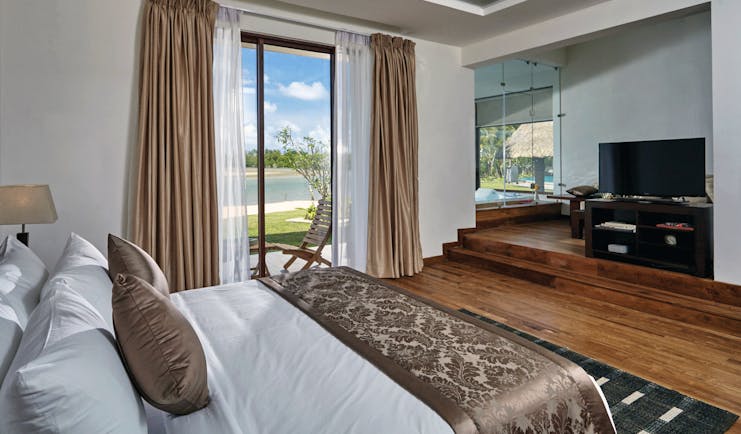 Aramanthe Bay Sri Lanka junior suite bed wooden floors private terrace