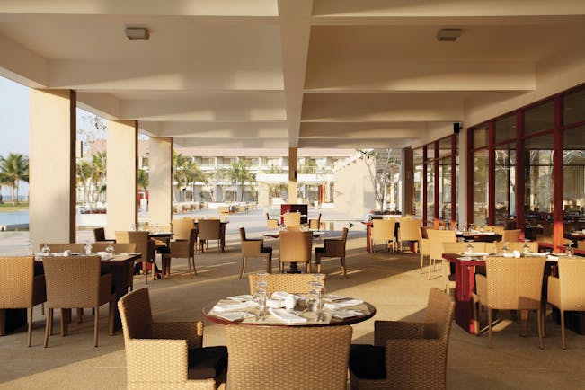 Amaya Beach Resort Sri Lanka restaurant covered dining area tables chairs
