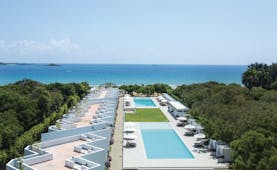 Anilana Nilaveli exterior pools terrace hotel building ocean in background
