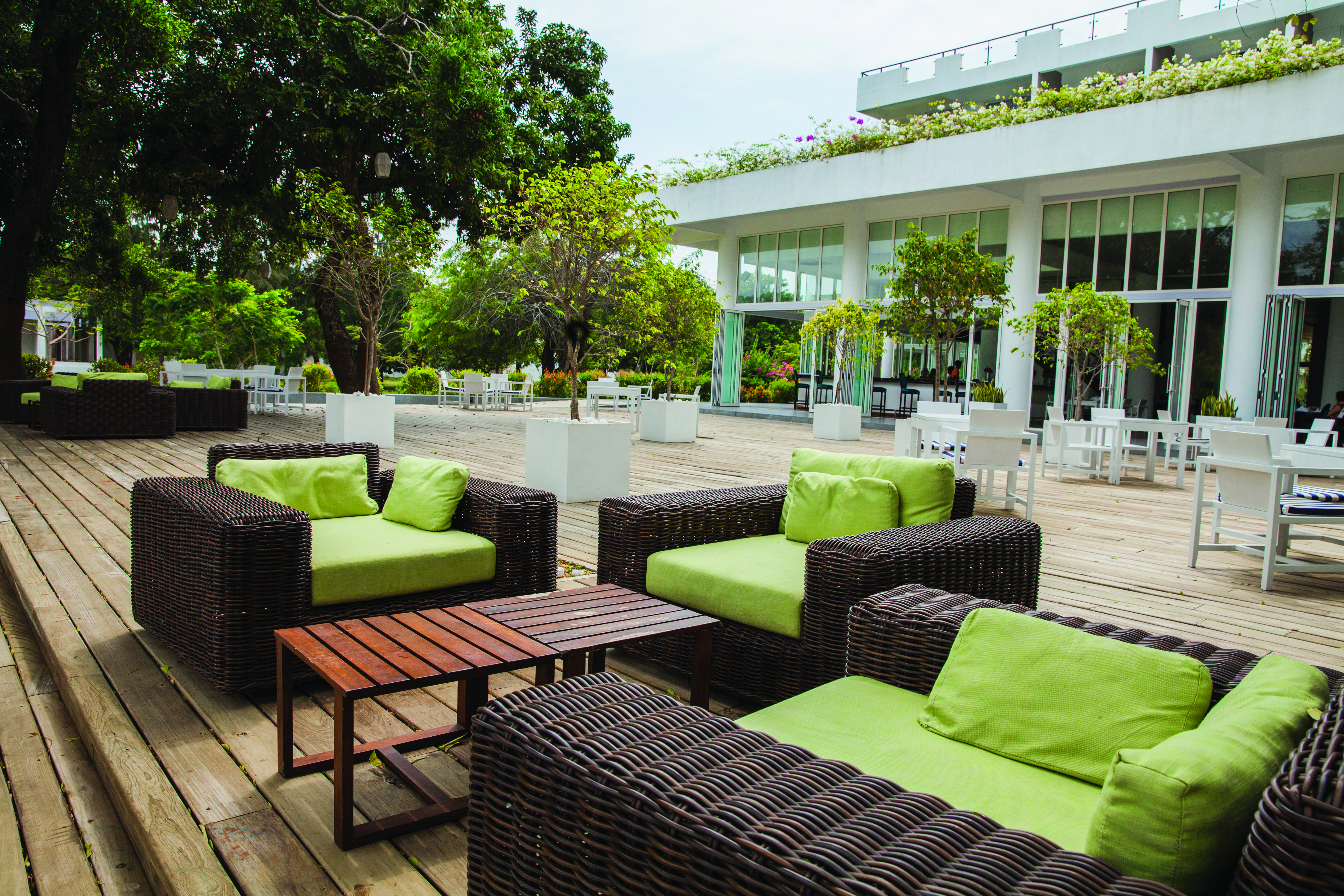 Anilana Nilaveli terrace chairs tables outdoor seating trees