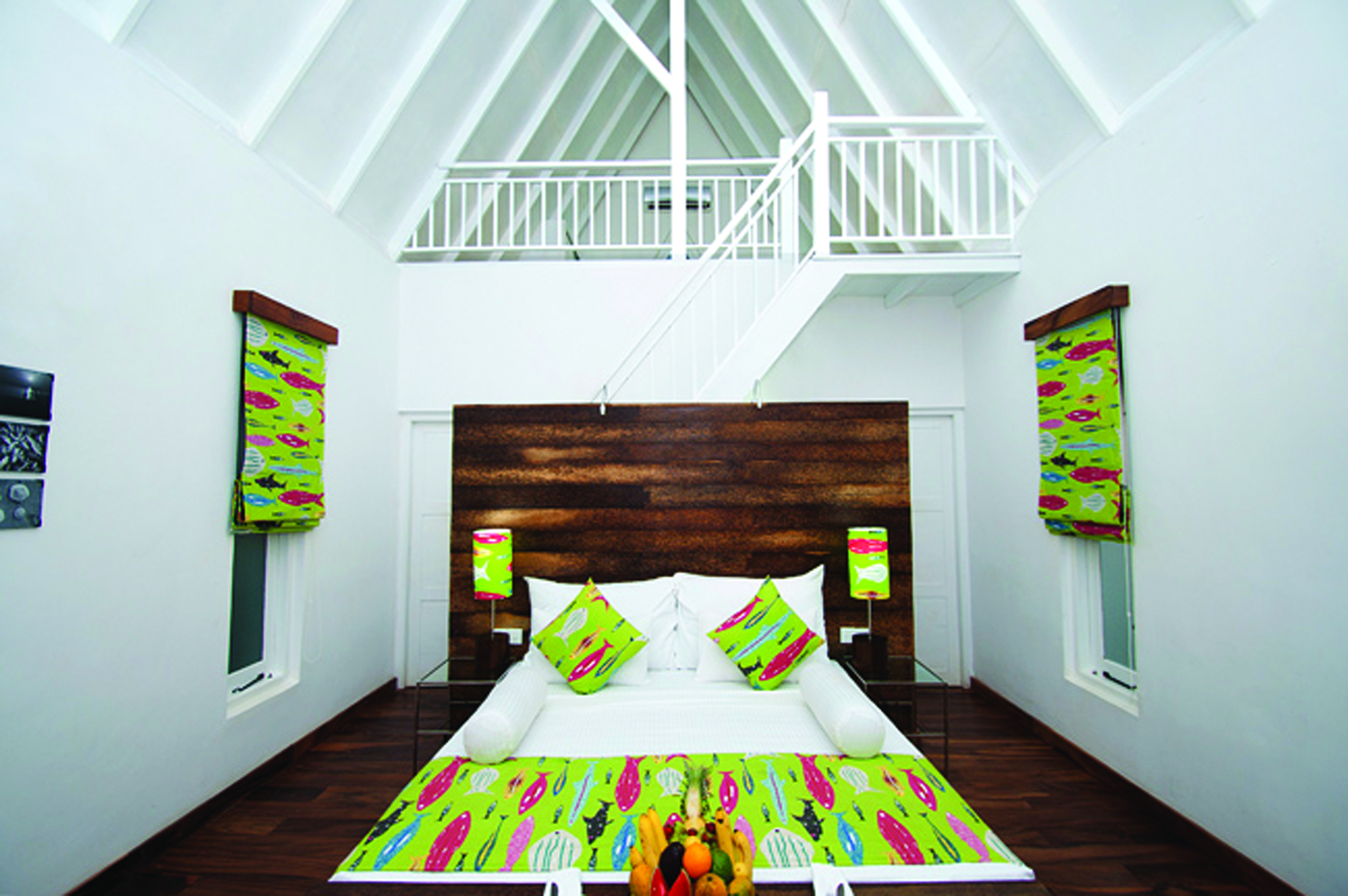 Maalu Maalu Sri Lanka deluxe attic room bed stairs leading to upper level bright modern décor