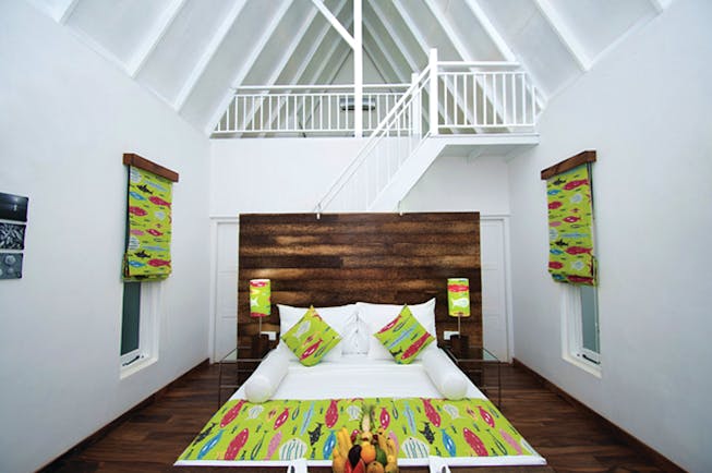 Maalu Maalu Sri Lanka deluxe attic room bed stairs leading to upper level bright modern décor