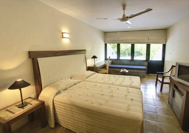 Nilaveli Beach Hotel Sri Lanka bedroom bed bench rustic décor