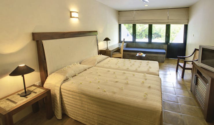 Nilaveli Beach Hotel Sri Lanka bedroom bed bench rustic décor