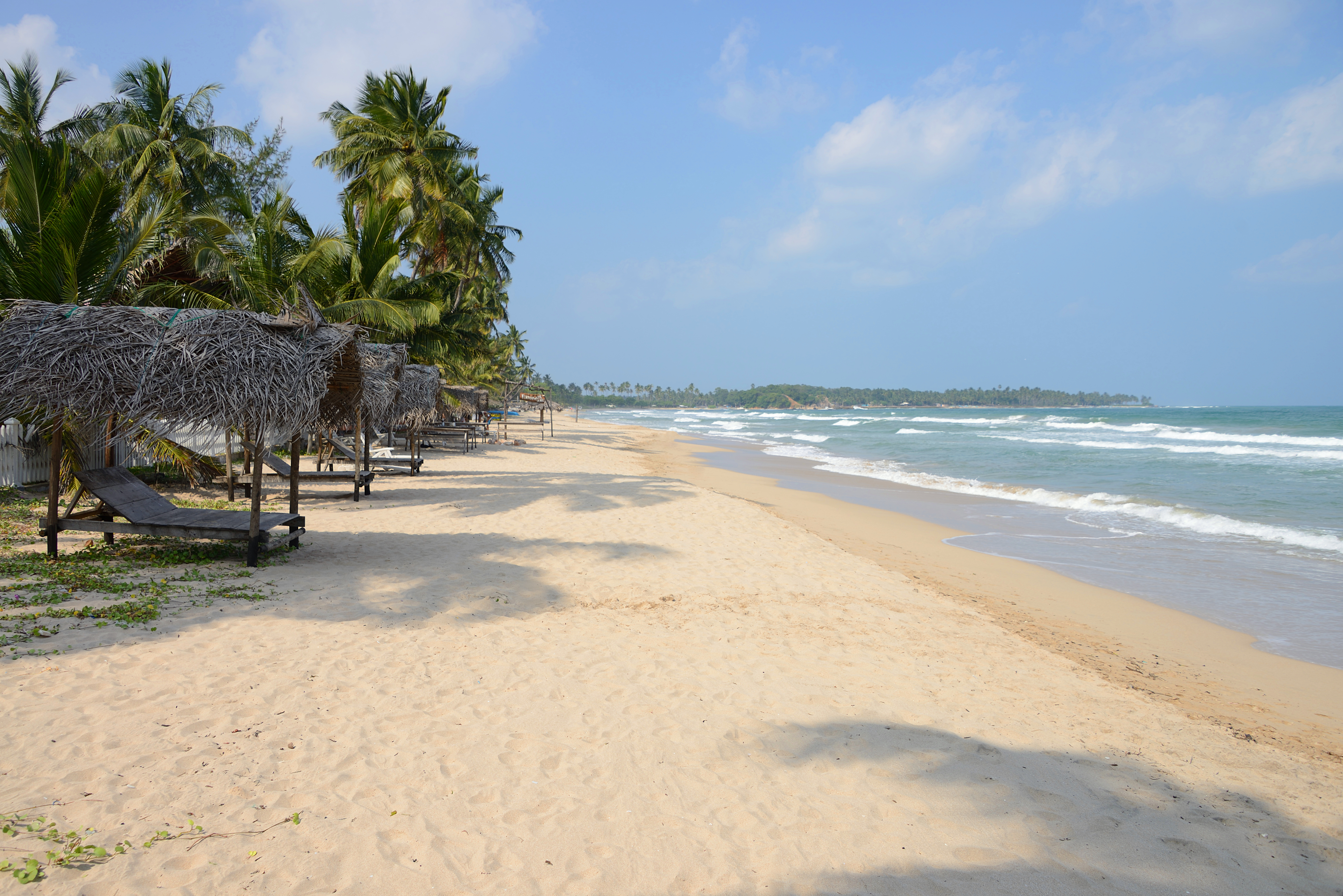 Uppuveli beach, white sand, clear blue water, palm trees
