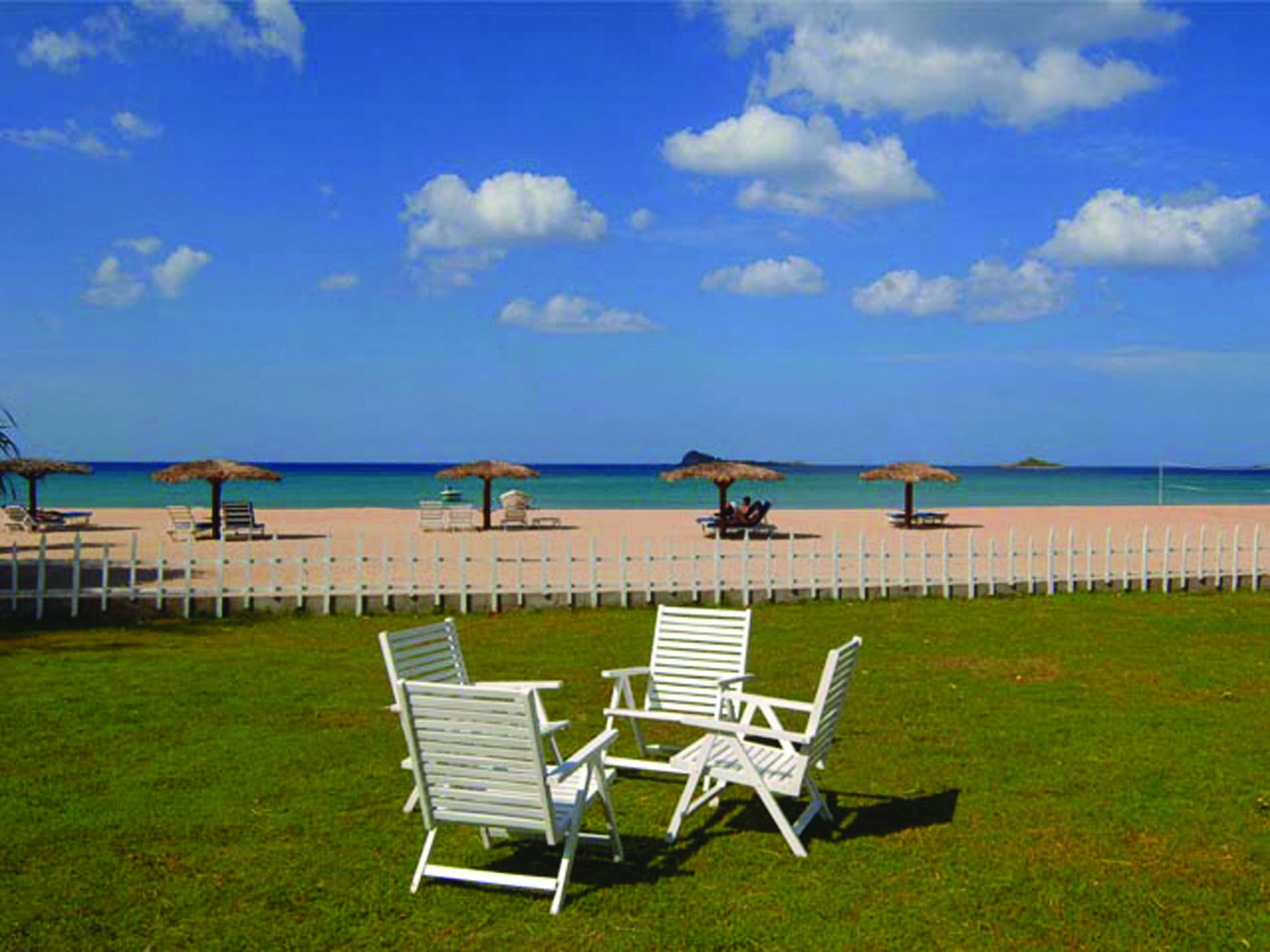 Pigeon Island Resort Sri Lanka beach deck chairs lawn sandy beach loungers umbrellas
