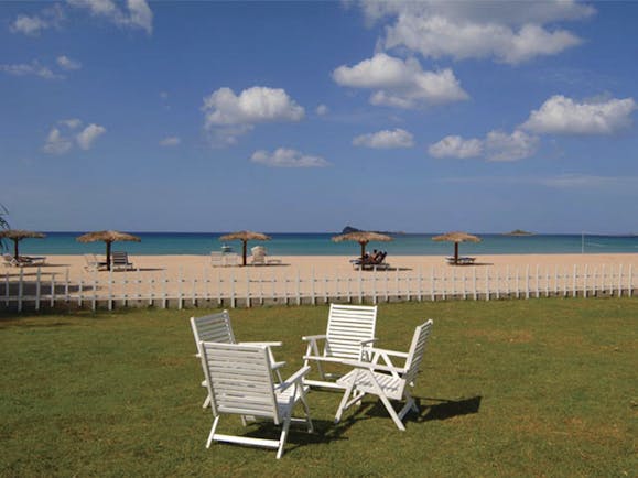 Pigeon Island Resort Sri Lanka beach deck chairs lawn sandy beach loungers umbrellas