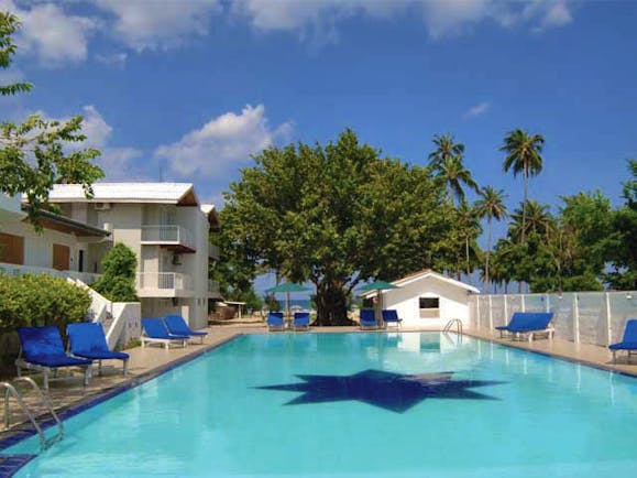 Pigeon Island Resort Sri Lanka pool sun loungers trees