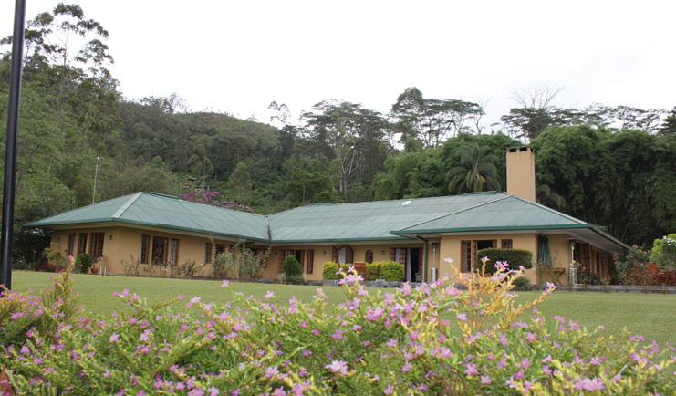 Ceylon Tea Trail Sri Lanka bungalow surrounded by trees lawn and gardens
